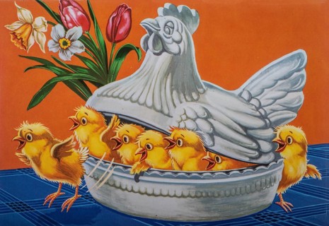 Old postcard and Easter card. Yellow chicks in a bowl in the shape of a brooding hen