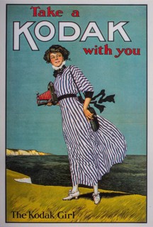 Old postcard. Woman advertising historic Kodak camera