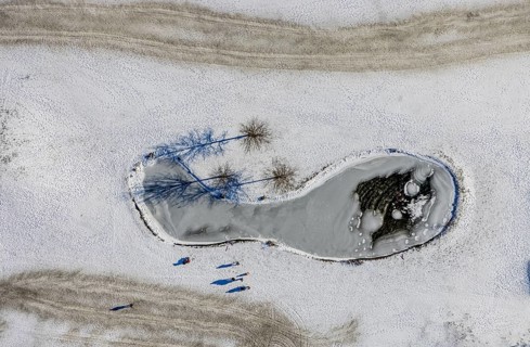 Aerial view, snow-covered golf course Huckingen and walkers, Huckingen, Duisburg, Ruhr area, North