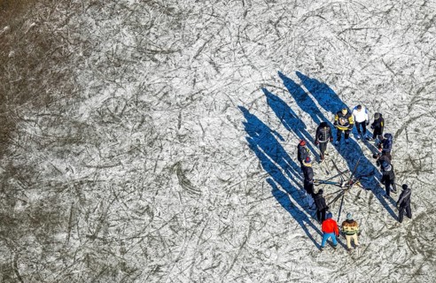 Aerial view, frozen Rhine meadow Ehingen, ice hockey players, Mündelheim, Duisburg, Ruhr area,