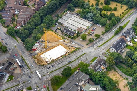 Aerial view, construction site and new building at the intersection of Sittardsberger Allee and