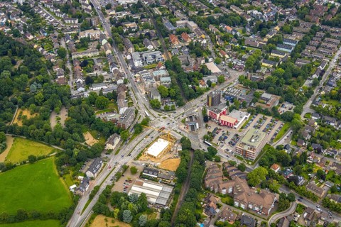 Aerial view, construction site and new building at the intersection of Sittardsberger Allee and