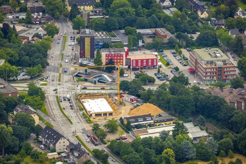 Aerial view, construction site and new building at the intersection of Sittardsberger Allee and
