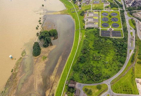 Aerial view, flood river Rhine, flooding river bank area at the sewage treatment plant Duisburg