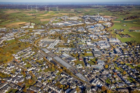 Aerial view, industrial area Brilon with Egger Holzwerkstoffe GmbH and wind farm in the background
