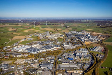 Aerial view, industrial area Brilon with Egger Holzwerkstoffe GmbH and wind farm in the background