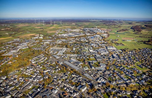 Aerial view, industrial area Brilon with Egger Holzwerkstoffe GmbH and wind farm in the background