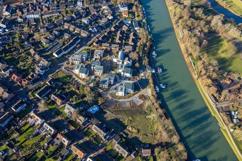 Aerial view of a construction site and new construction of residential buildings with barrier-free