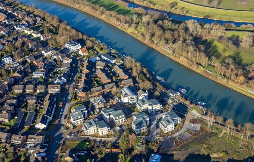 Aerial view of a construction site and new construction of residential buildings with barrier-free