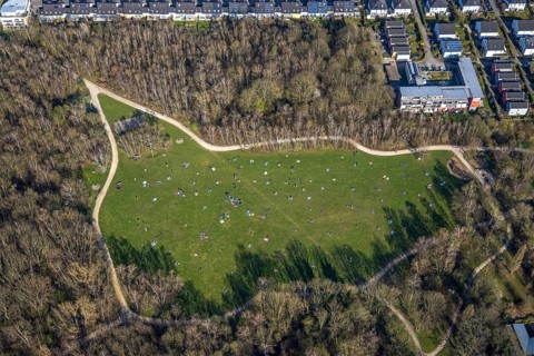 Aerial view, the Tremoniapark a large playground and sunbathing lawn, spring weather on Dortmund's