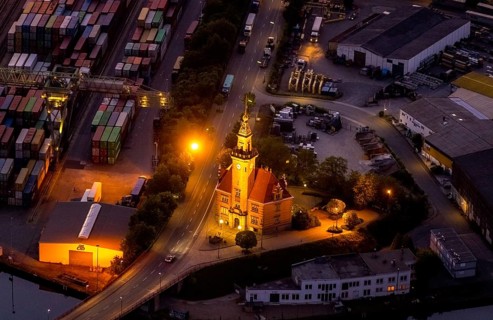 Aerial view, night view of Dortmund harbour, historic building old harbour office, coal port of the