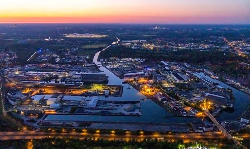 Aerial view, night view of Dortmund harbour, historical building old harbour office, container