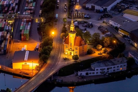 Aerial view, night view of Dortmund harbour, historic building old harbour office, coal port of the
