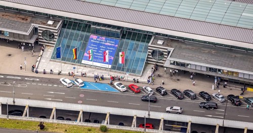 Aerial photo, Dortmund airport, departure level, arrival right of way, flags at airport entrance,