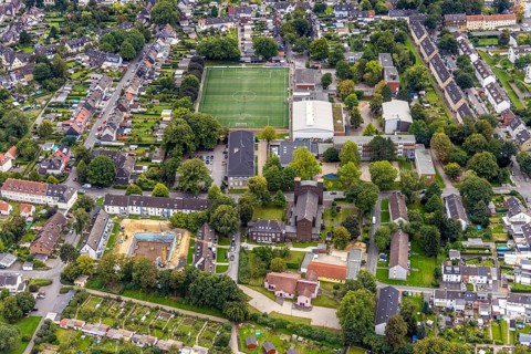 Aerial view, St. Charles Borromeo Catholic Church and Am Wasserfall sports ground in the Dorstfeld