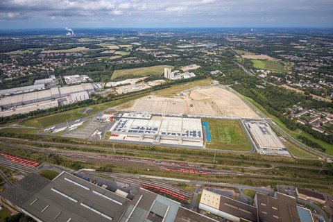 Aerial view, construction site with the new REWE logistics centre on Walzwerkstraße at the old