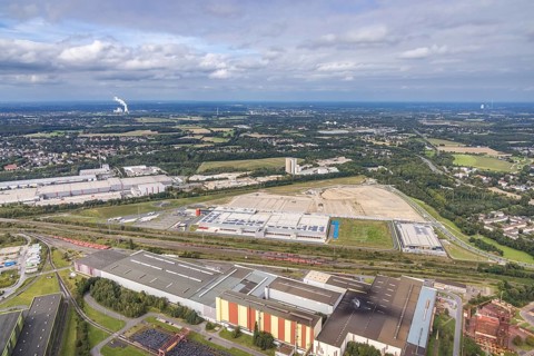 Aerial view, construction site with the new REWE logistics centre on Walzwerkstraße at the old