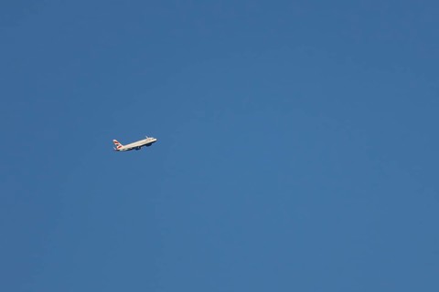 Airbus A320-232 jet passenger aircraft of British Airways airlines in flight in a blue sky, London,