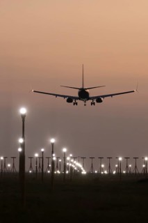 Boeing 737 jet aircraft of Ryanair airlines in flight landing at sunset at London Stansted airport,