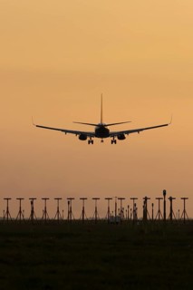 Boeing 737 jet aircraft of Ryanair airlines in flight landing at sunset at London Stansted airport,