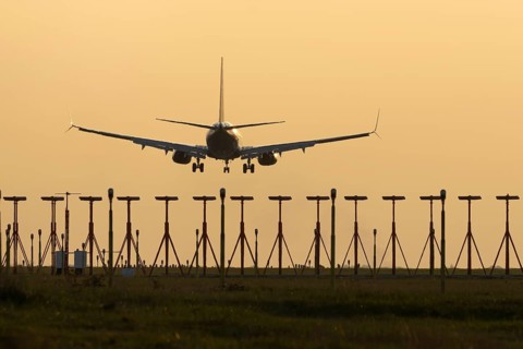 Boeing 737 jet aircraft of Ryanair airlines in flight landing at sunset at London Stansted airport,