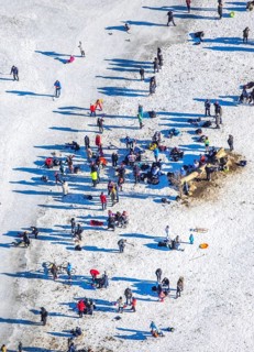 Aerial view, ice rink, ice skaters and pedestrians on frozen Rhine meadow in Lörrick near the