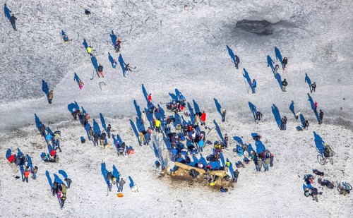 Aerial view, ice rink, ice skaters and pedestrians on frozen Rhine meadow in Lörrick near the