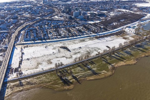 Aerial view, ice rink, ice skaters and pedestrians on frozen Rhine meadow in Lörrick near the
