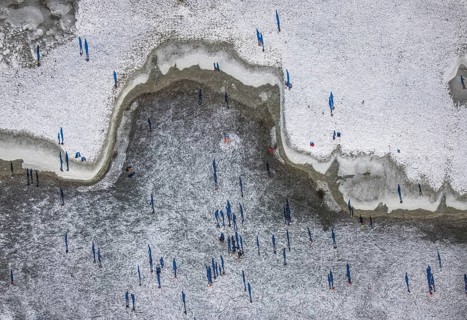 Aerial view, ice rink, ice skaters and pedestrians on frozen Rhine meadow in Lörrick near the