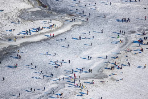 Aerial view, ice rink, ice skaters and pedestrians on frozen Rhine meadow in Lörrick near the