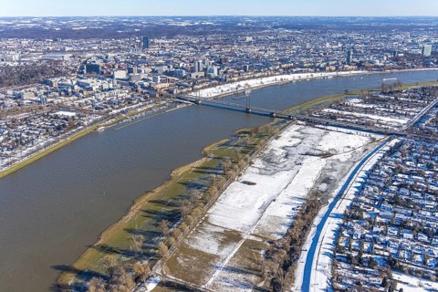 Aerial view, ice rink, ice skaters and pedestrians on frozen Rhine meadow in Lörrick near the
