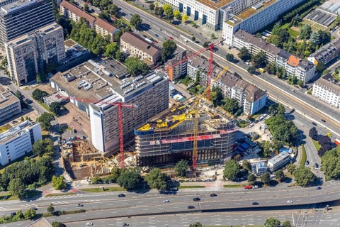 Aerial view, construction site and new construction of the three-storey Eclipse high-rise building