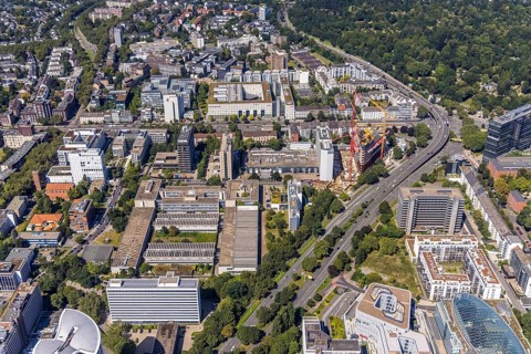 Aerial view, construction site and new construction of the three-storey Eclipse high-rise building