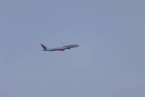 Airbus jet passenger aircraft of Air India airways in flight in a blue sky, London, England, United