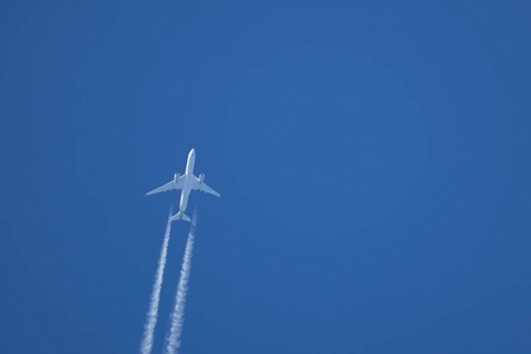 Airbus A350-900 passenger jet aircraft of Singapore airlines flying with a vapour trial or contrail