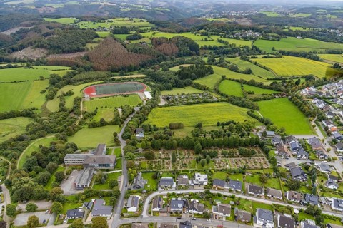 Aerial view, meadows and fields at Klevinghauser Straße between cemetery and sports field as well