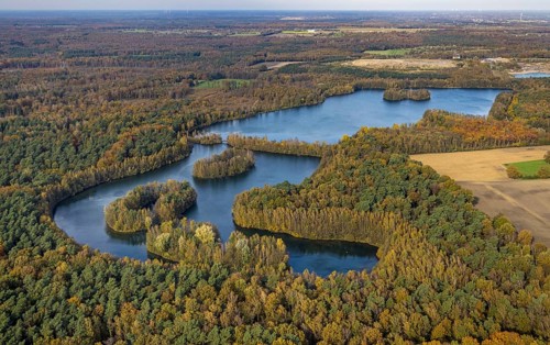 Aerial view, Heidesee surrounded by autumnal forest in the district Kirchhellen-Süd in Bottrop,
