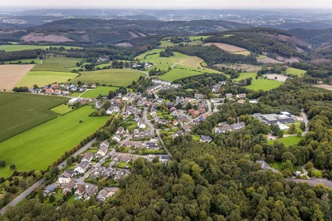 Aerial view, hilly landscape and local view with specialised hospital Homborn and short-term home
