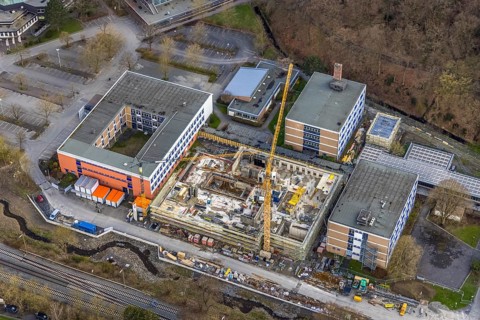 Aerial view, construction site and new building at Berufskolleg Berliner Platz, Hüsten, Arnsberg,
