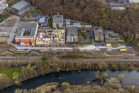Aerial view, construction site and new building at Berufskolleg Berliner Platz, Hüsten, Arnsberg,