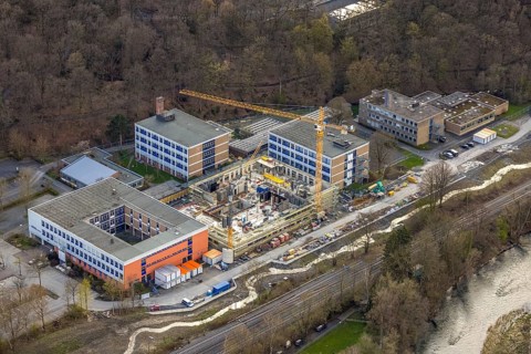 Aerial view, construction site and new building at Berufskolleg Berliner Platz, Hüsten, Arnsberg,