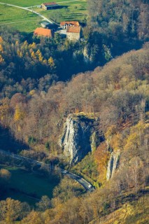 Aerial view, Reckenhöhle dripstone cave in the autumnal forest in the district Volkringhausen in