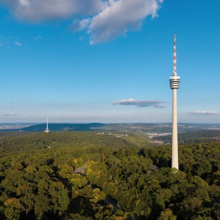 High television tower above lush greenery, soft clouds in the clear sky, Stuttgart-Degerloch,