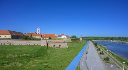 Fortress with church tower and cycle path and blue tread in the foreground, Tvrda, Osijek,