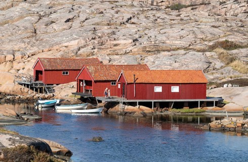 Falun red fishermen's huts by the sea, Bohus granite, rocky coast, Ramsvik, Ramsviklandet nature
