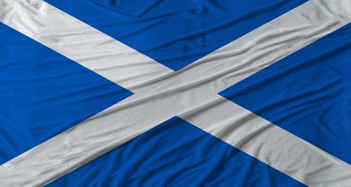 Scottish flag waving. Flag of Scotland with cloth texture