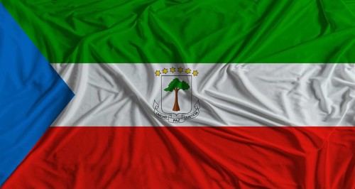 Equatoguinean flag with fabric texture background. National flag of Equatorial Guinea