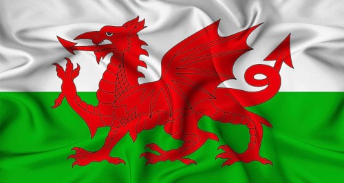 Realistic Wales flag waving. Close up of flag of Wales with cloth texture