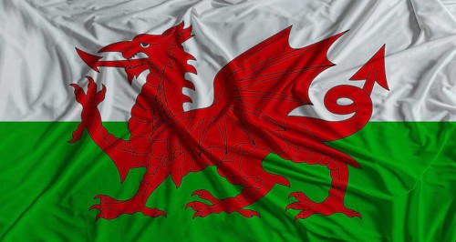 Welsh flag with fabric texture background. National flag of Wales, United Kingdom