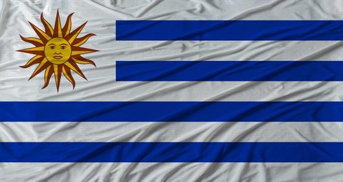 Uruguayan flag waving. Flag of Uruguay with cloth texture